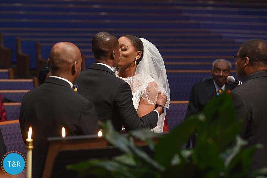 A couple kisses during their Detroit wedding ceremony