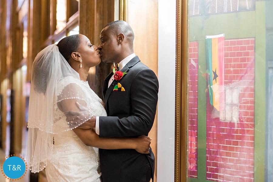 A newly married couple kisses inside Detroit's Fisher building