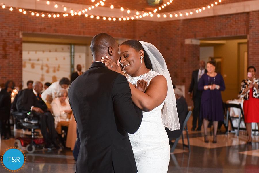 A couple embraces during their first wedding dance at Detroit's Rattlesnake club