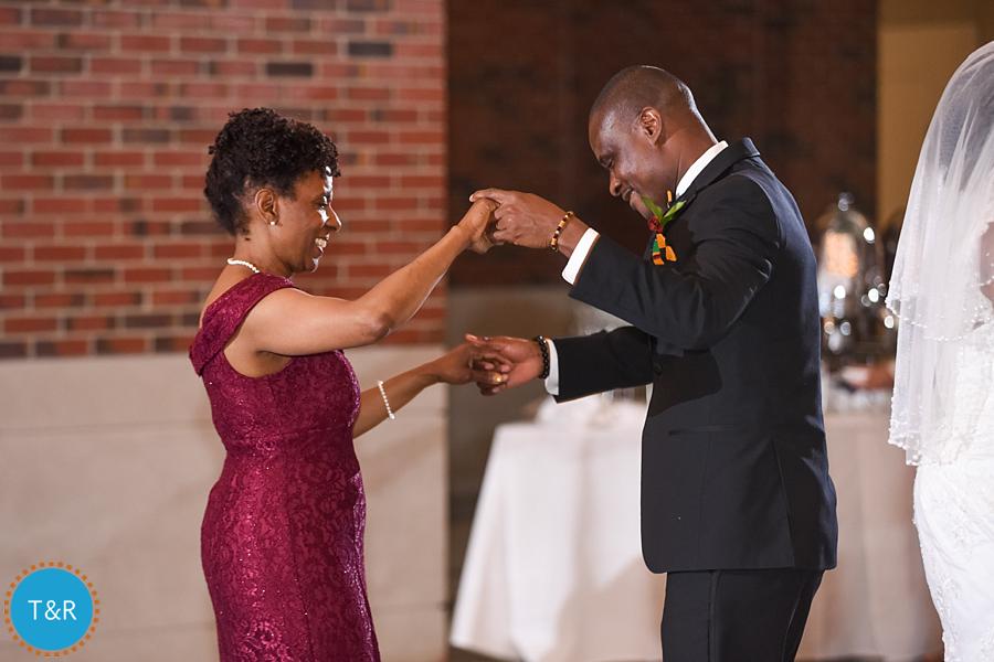 A groom dances with his new mother in law at Detroit's Rattlesnake club