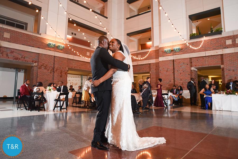 A newly married couple embraces during their first dance at Detroit's Rattlesnake club