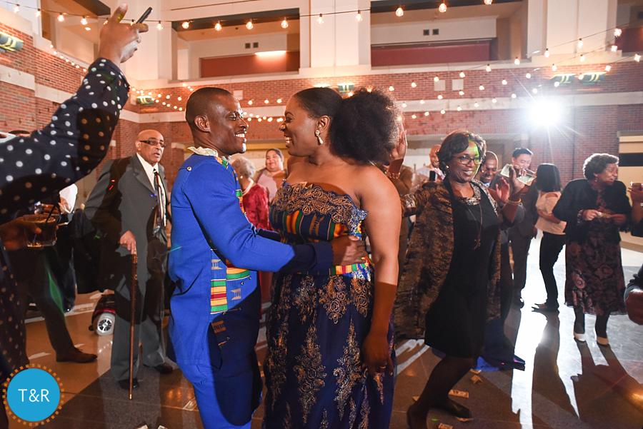 A couple dances during their multicultural Detroit wedding reception