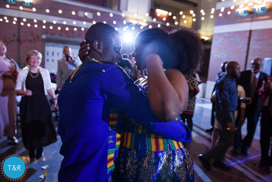 A couple embraces during a traditional African money dance at Detroit's Rattlesnake club