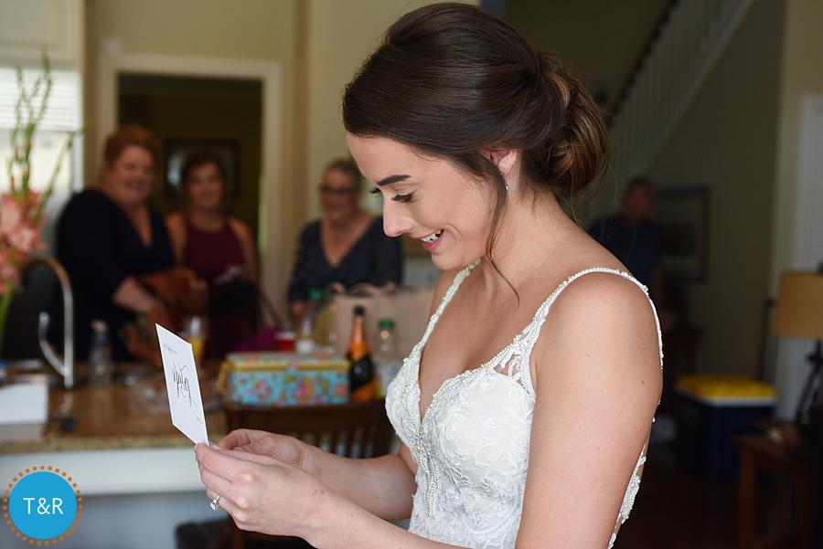 The bride reading a card from her girls