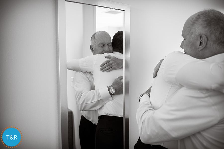 The groom and his dad, hugging