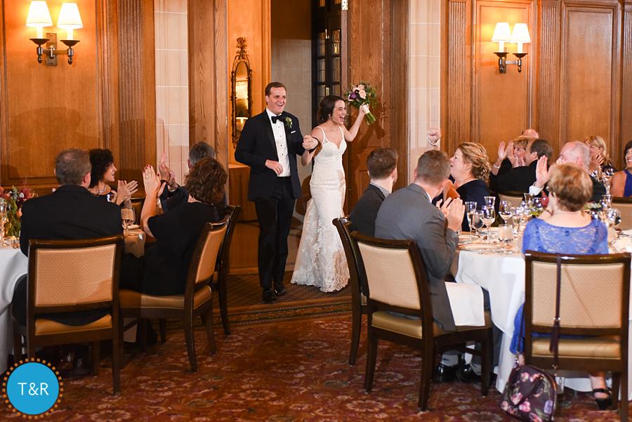 Katie and Drew entering their reception at the DAC for the first time