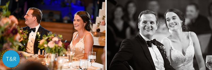 The happy couple laughing during the toasts