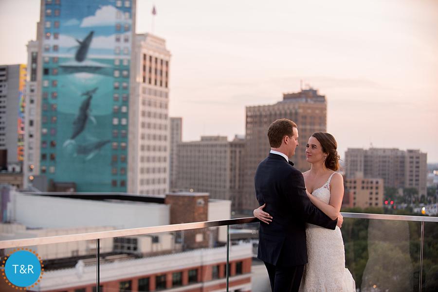 The bride and groom on a balcony in Detroit