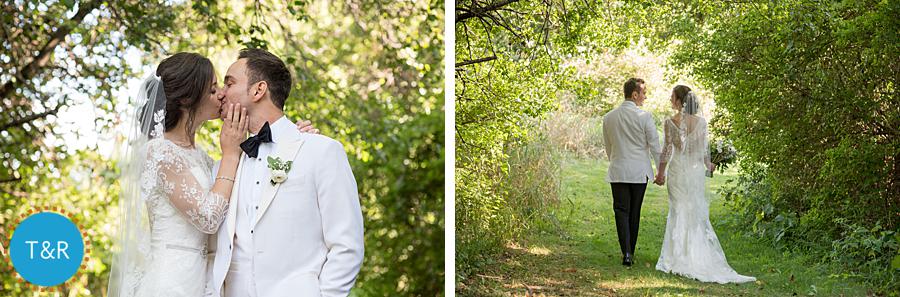 Bride and groom walk and embrace on the grounds of Frutig Farms Misty Farm after their Ann Arbor wedding ceremony